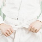 A white karate uniform and a white karate belt.