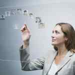 Human resources manager assessing candidates on advanced touch screen interface