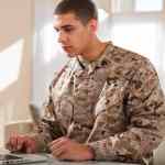 US Marine Corps Solider Working on Laptop